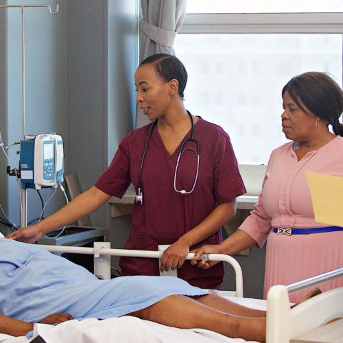 nurses taking care of patient in hospital