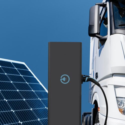 semi-truck charging with solar panel in frame