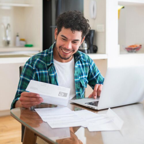 happy guy checking over bills