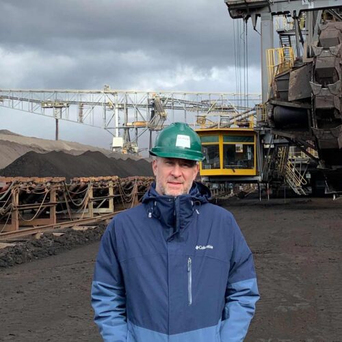 Jeremy Richardson in front of a hydroelectric dam