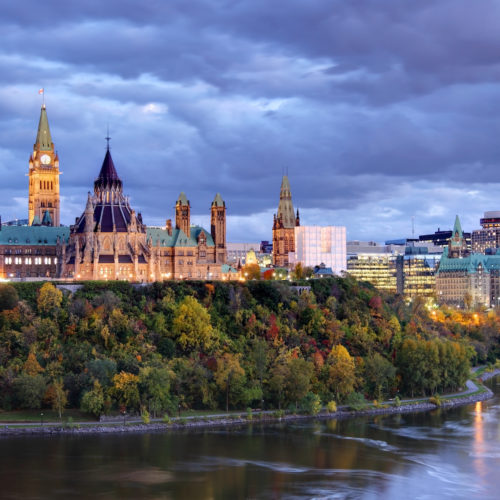 Parliament Hill atop a dramatic hill overlooking the Ottawa River in Ottawa, Ontario