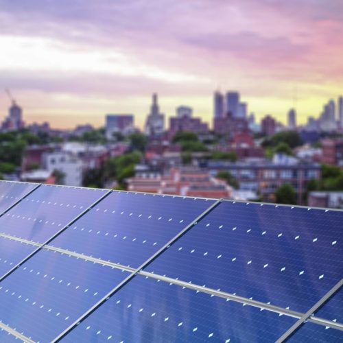 solar panel in forefront of city